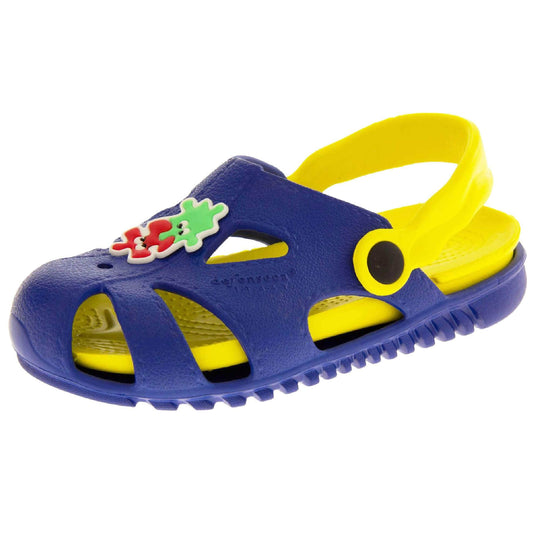 Kids pool clogs. Fisherman style synthetic sandals with blue upper and outer sole. Yellow ankle strap and insole. Green and red jigsaw pieces detail to the centre of the upper. Left foot at an angle.