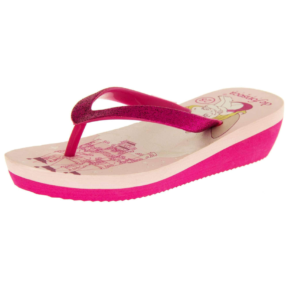 Foam wedge sandals for girls. Fuchsia bottom half of the sole with ridges for grip, baby pink top half with bright pink fantasy design to the insole. Fuchsia strap with toe post covered on top with bright pink glitter. Left foot at an angle.