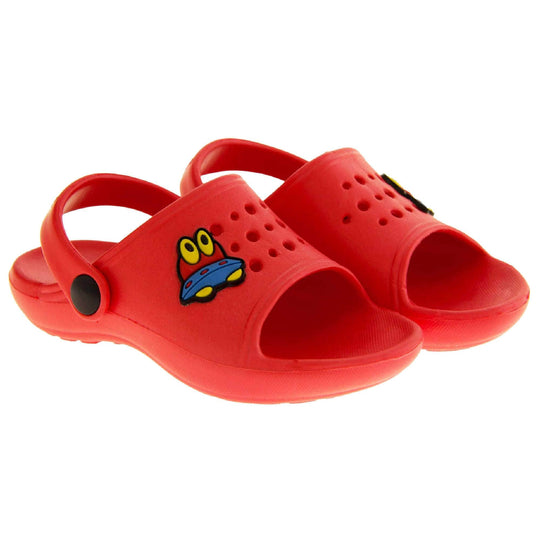 Kids Summer Clogs. Red synthetic clog style shoes. Open toed with cut out holes in the upper with alien detail just off centre. Red strap that goes along the back of your heel. The strap can be moved along the top of the shoe instead to make the shoe a mule.  Both shoes next to each other at a slight angle.