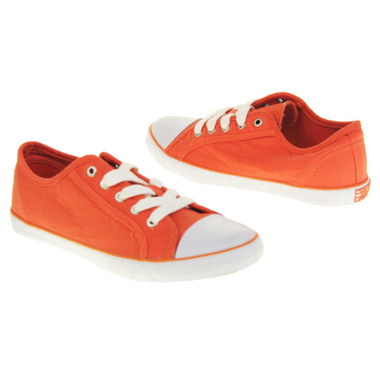 Lace up canvas sneakers. Women's shoes in a low top sneaker style with a orange canvas upper. White laces and white rubber toe bumper. Orange textile lining and white outsole with an orange line running around it and beige base. Both feet at an angle facing top to tail.