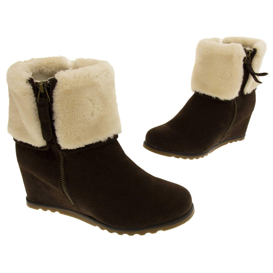 Ladies ankle boots. Dark brown faux suede wedge ankle boots. With zip fastening. Cream faux fur wide collar. Light brown sole with deep grip to the base. Both feet in a T shape about an inch apart.