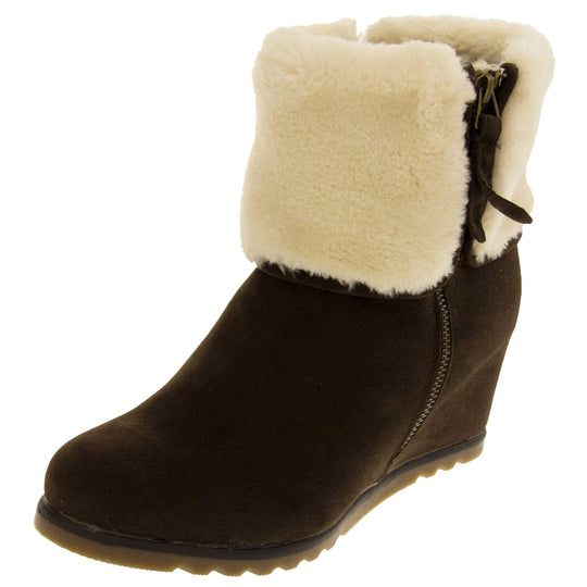 Ladies ankle boots. Dark brown faux suede wedge ankle boots. With zip fastening. Cream faux fur wide collar. Light brown sole with deep grip to the base. Left foot at an angle.