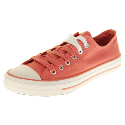 Ladies canvas pumps. Women's shoes in a low top sneaker style with a pink canvas upper. Pink laces with top two rows being white. Pink textile lining and white outsole with a pink line running around it. Left foot at an angle.