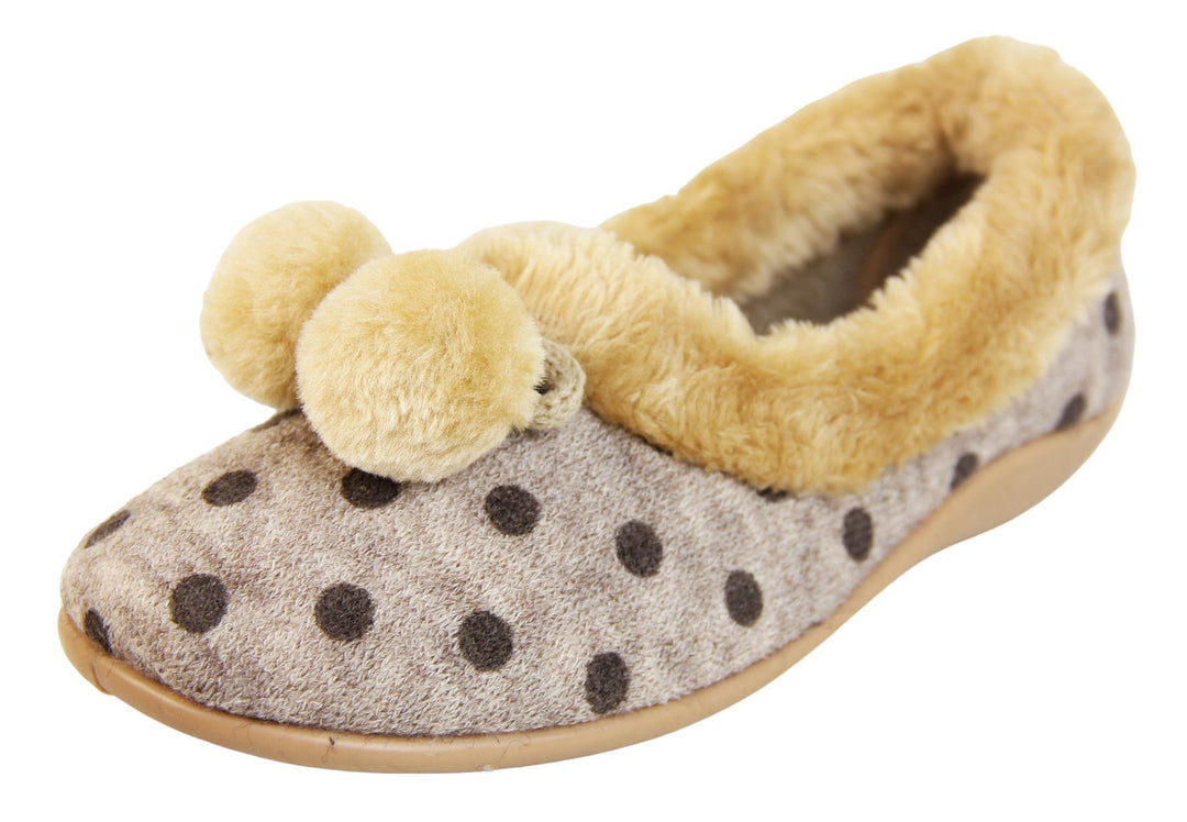 Beige spotty ladies slippers with faux fur trim and pom poms left view