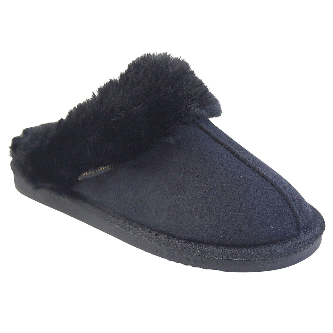 Ladies Memory Foam Slippers. Mule style slippers with black faux suede uppers. Black faux fur lining and collar. Firm black outsole with grip on the bottom. Right foot at an angle.