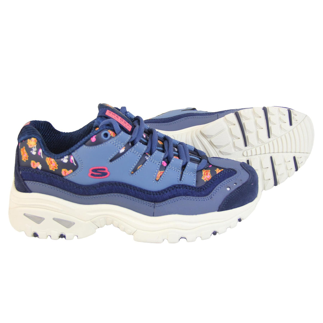 Blue Sketchers trainers with denim edging and a floral print. Lace up fastening with thick white soles.  side view and sole