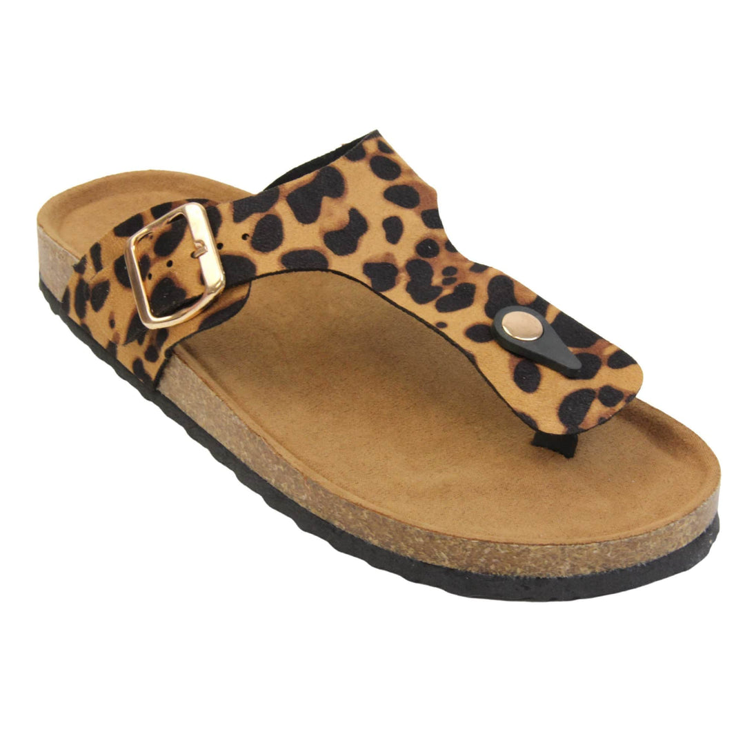 Leopard print flip flops. Leopard print faux suede strap with toe post to the front and gold buckle to the outside. Soft tan faux suede footbed with cork effect outsole and black sole. Right foot at an angle.