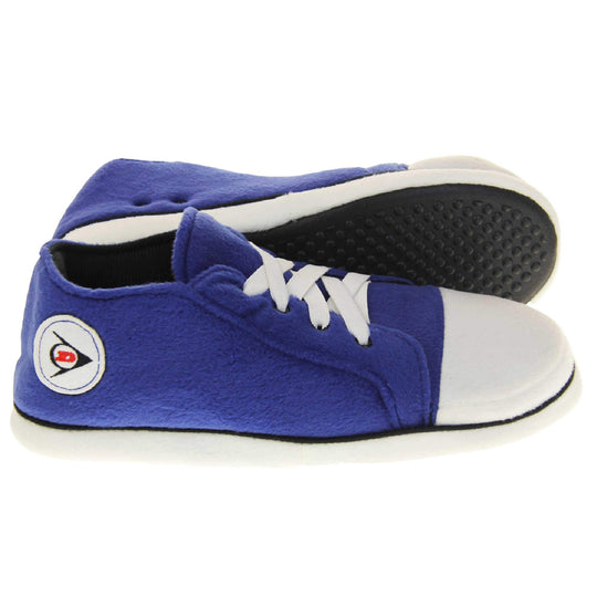 Low rise sneaker slippers. Blue soft fabric upper in low-rise sneaker style. With white elasticated laces and white circle with Dunlop logo to the side. White edge around the sole of the shoe. Black textile lining. Black sole with bumps for grips. Both feet from side profile with left foot on its side to show the sole.