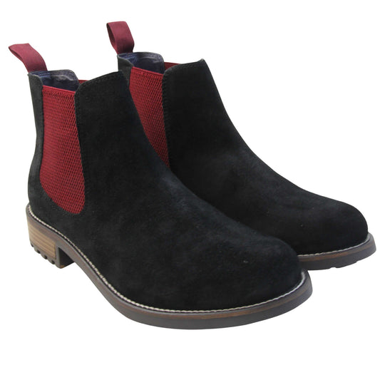 Mens black Chelsea boots. Ankle boots with black suede leather uppers and red textile elasticated side panels. Red textile tab to the back rim to help pull shoes on. Embossed Oakenwood brand to the outside heel of the boot. Black sole with very slight heel. Both feet together at a slight angle.