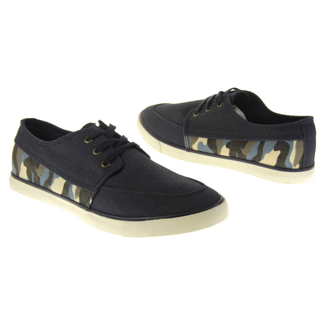 Mens camouflage pumps. Navy blue canvas upper with blue camo strip around the heel. Navy laces. White synthetic sole and dark textile lining. Both feet at a slight angle facing top to tail.