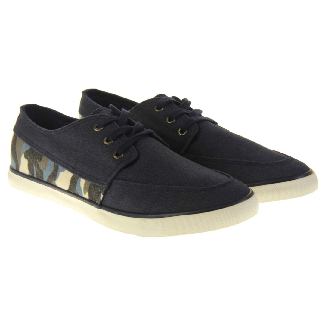 Mens camouflage pumps. Navy blue canvas upper with blue camo strip around the heel. Navy laces. White synthetic sole and dark textile lining. Both feet together at an angle.