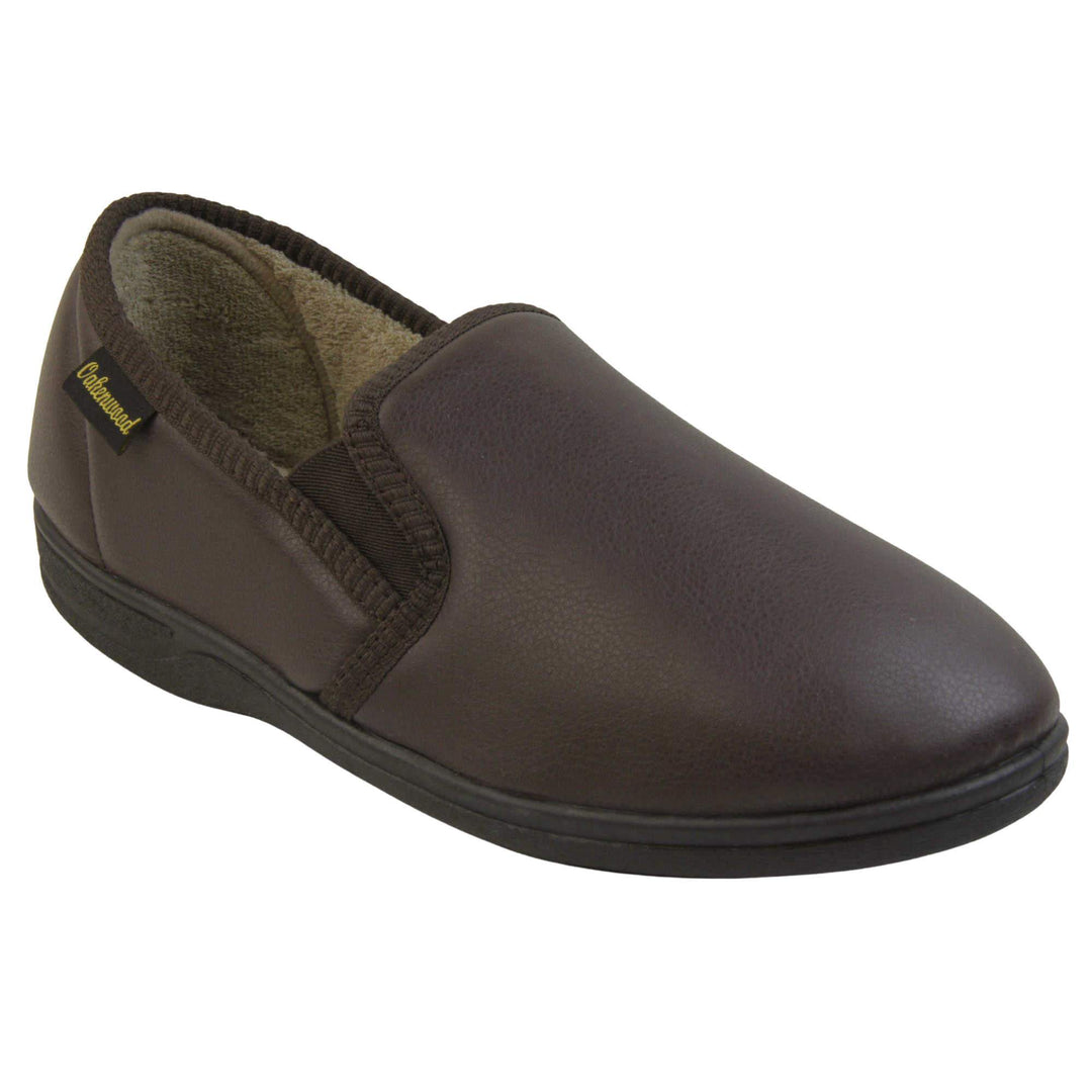 Mens faux leather slippers. Brown faux leather classic full back slipper with beige fleece lining. Right foot from an angle.