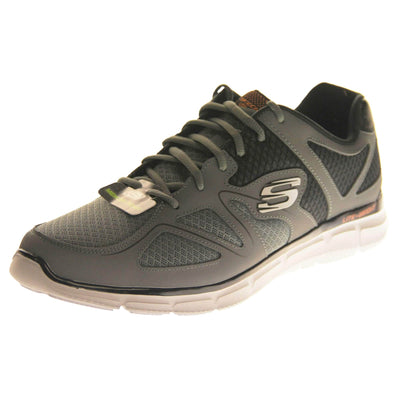 Mens grey Skechers. Charcoal grey mesh and leather upper with black elasticated laces for a slip on trainer. Black Skechers logo to the heel and chunky white outsole with grip. Left foot at an angle.