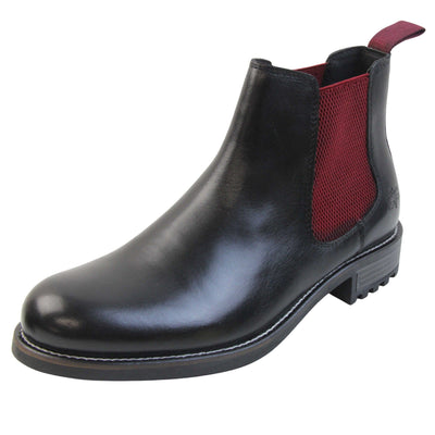 Mens leather Chelsea boots black. Ankle boots with black leather uppers and red textile elasticated side panels. Red textile tab to the back rim to help pull shoes on. Embossed Oakenwood brand to the outside heel of the boot. Black sole with very slight heel. Left foot at an angle.