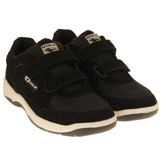 Men's leather trainers. Classic trainer style in wide fit with black coated leather upper and black stitching detail. Two black touch fasten straps with black tongue and black textile lining. Black and white Gola branding to the side. White outsole with black base. Both feet together from an angle.