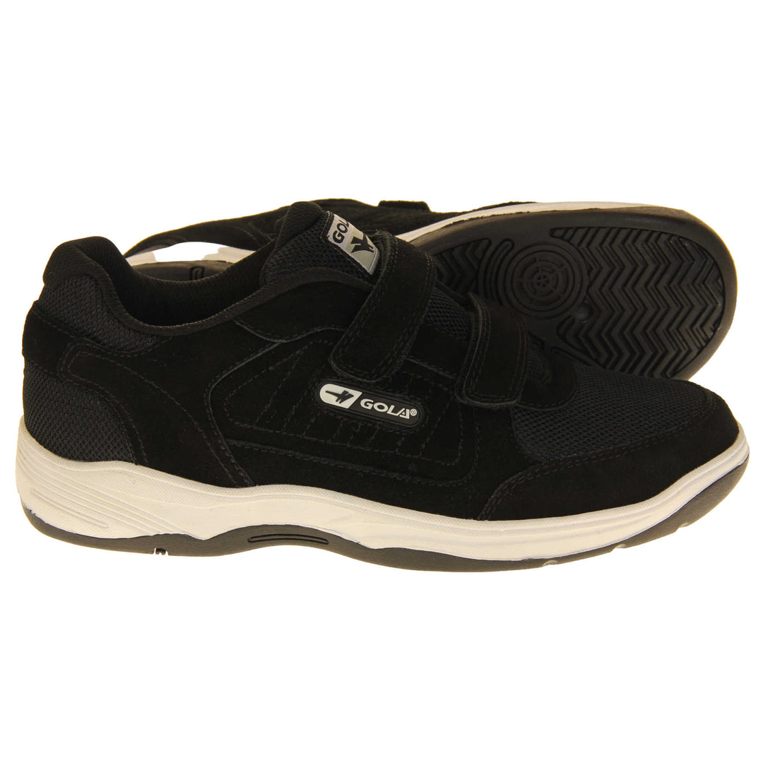 Men's leather trainers. Classic trainer style in wide fit with black coated leather upper and black stitching detail. Two black touch fasten straps with black tongue and black textile lining. Black and white Gola branding to the side. White outsole with black base. Both feet from a side profile with the left foot on its side to show the sole.