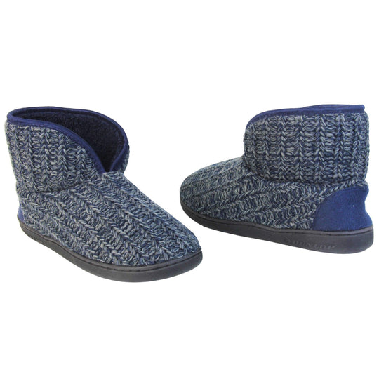 Mens memory foam slippers. Slipper boots with a navy blue knit upper. Navy fabric piping around the collar. Navy textile patch over the heel to reinforce. Thick black synthetic sole with Dunlop branding on. Navy faux fur lining. Both slippers slightly at an angle facing top to tail.