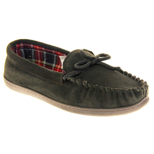 Mens plaid slippers. Moccasin style slipper with dark brown suede upper and leather bow to the top. Blue and red tartan plaid lining. Dark brown synthetic sole. Right foot at an angle.