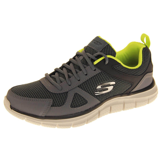 Mens Skechers sports trainers. Charcoal grey mesh and leather upper with grey laces and lime green lining. White Skechers logo to the side and chunky white outsole with black bottom with grip. Left foot at an angle.