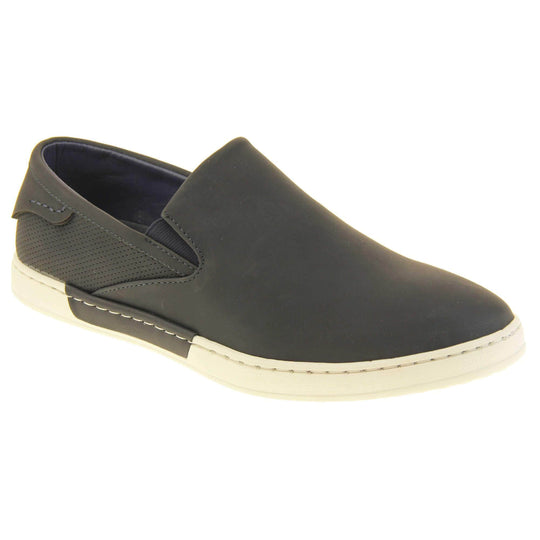 Mens slip on shoes. Black faux leather upper. White synthetic sole and dark textile lining. Right foot at an angle