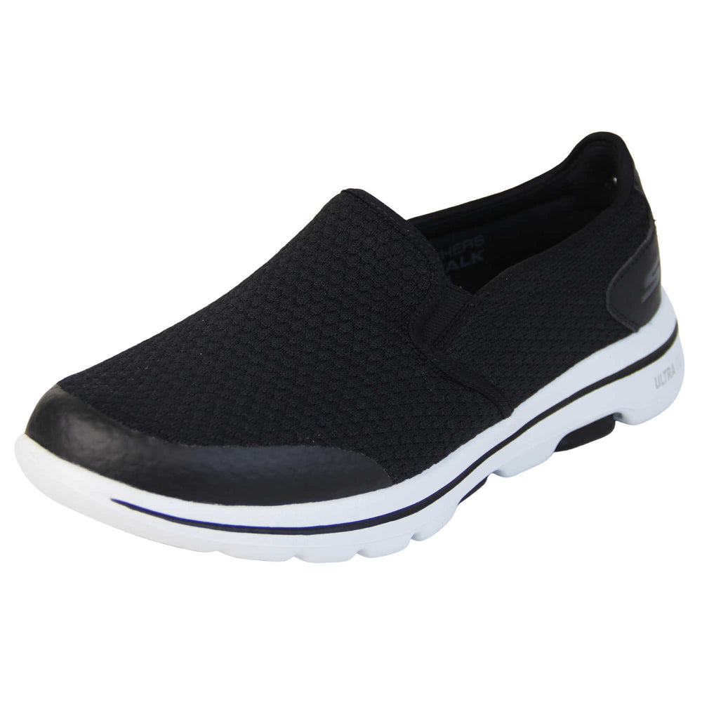 Mens wide fit skechers. Mens loafer style trainers. Black woven mesh upper. Skechers S logo to the back. chunky white sole with a black ling running around the middle and grip to the bottom. Black textile lining. Left foot at an angle.