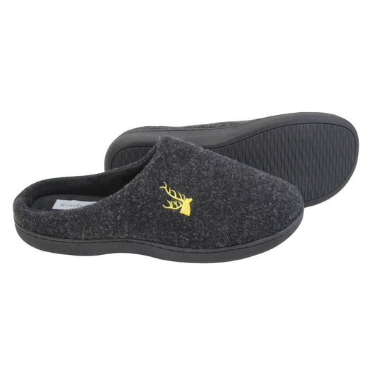 Mens backless slippers. Mule style slippers with black fleece uppers with an embroidered stag head to the top, on the outside. Black terry lining and firm black sole.  Both feet from a side profile with the left foot on its side behind the the right foot to show the sole.