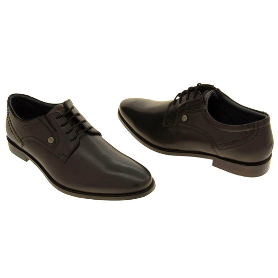 Mens black dress shoes. Mens formal shoes with a black leather upper and black stitching detail. Black laces to the front. Small silver stud on the side with S.Oliver written on. Black sole with very slight heel. Black lining. Both feet at an angle about an inch apart facing top to tail.