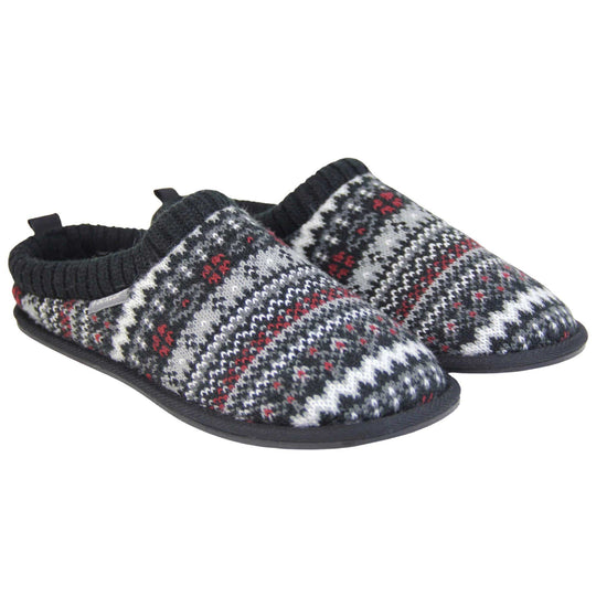 Mens black mule slippers. Mens slippers in a mule style. With black knit fabric upper with grey, red and white pattern. Black faux fur lining. Black hard synthetic soles with grip to the base. Both feet together from a slight angle.