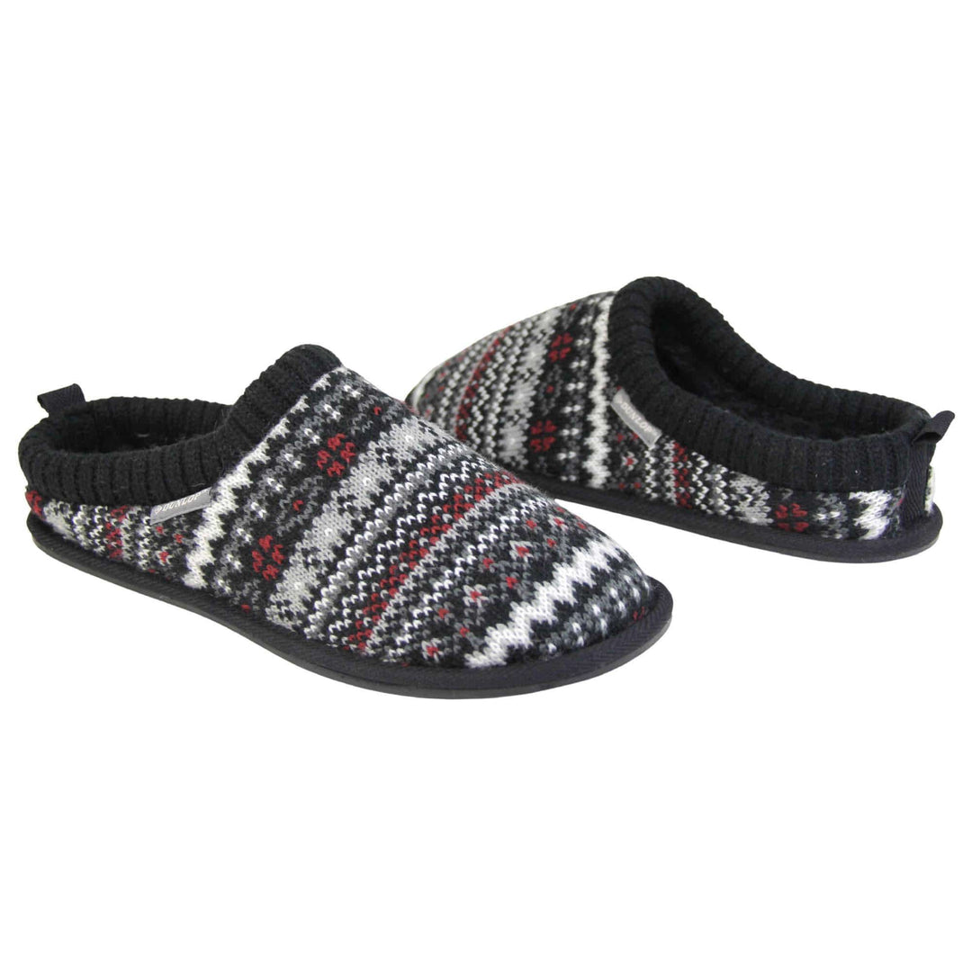 Mens black mule slippers. Mens slippers in a mule style. With black knit fabric upper with grey, red and white pattern. Black faux fur lining. Black hard synthetic soles with grip to the base. Both feet from an angle facing top to tail.