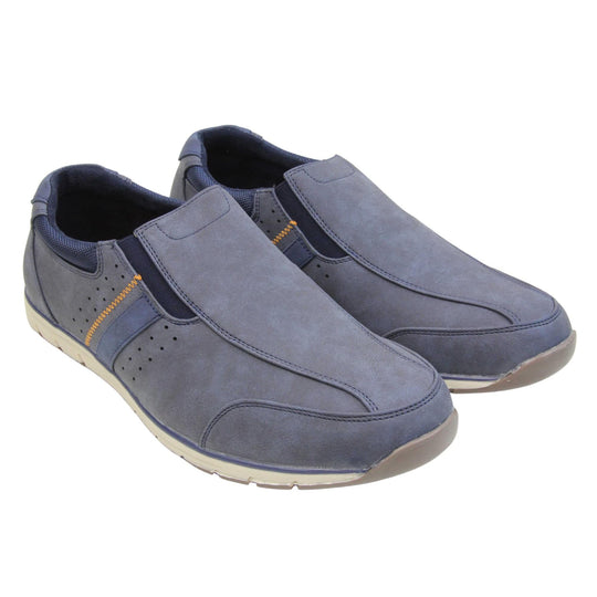 Mens blue suede trainers. Slip on trainers with navy blue faux suede uppers. Elasticated side gussets in dark blue and a navy diagonal stripe to the side of the shoe. Dark blue collar around the neck of the shoe with Oakenwood branding to the heel. Dark blue lining and a white outsole with grey sole. Both feet together at a slight angle.