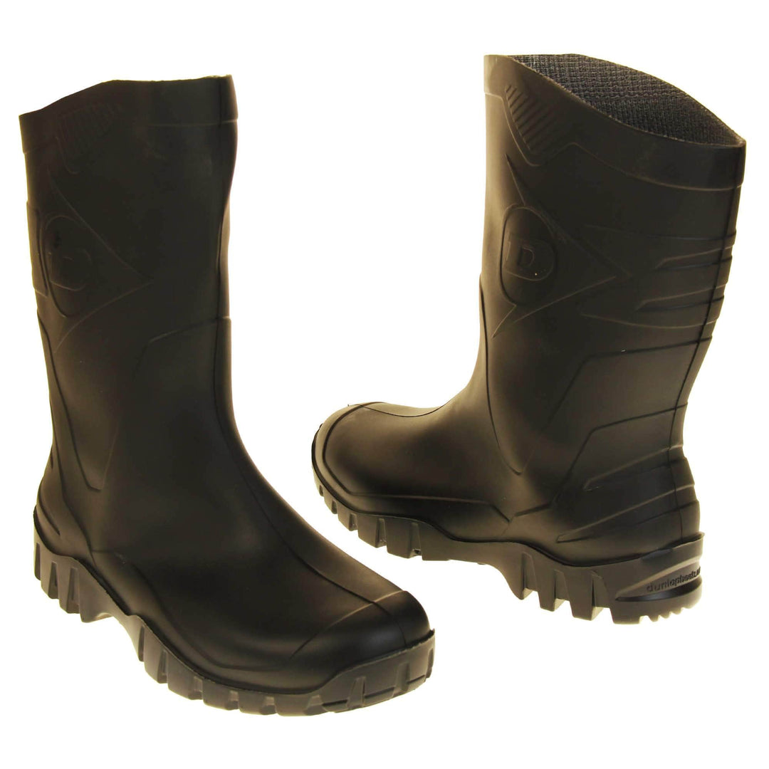 Mens Short Wellies. Black calf length wellies with a waterproof rubber upper and sole. With embossed pattern down the back of the boot and Dunlop logo on the side. Both feet facing top to tail at a slight angle.