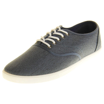 Mens canvas pumps. Navy blue canvas upper with white laces. White synthetic sole and dark textile lining. Left foot at an angle