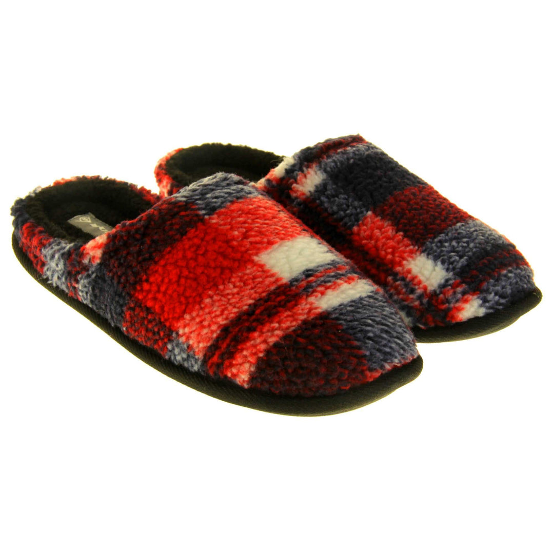 Mens check mule slippers. Mens slippers in a mule style. With red, white and black soft fabric upper. Black fleecy lining. Black hard synthetic soles with grip to the base. Both feet together from a slight angle.