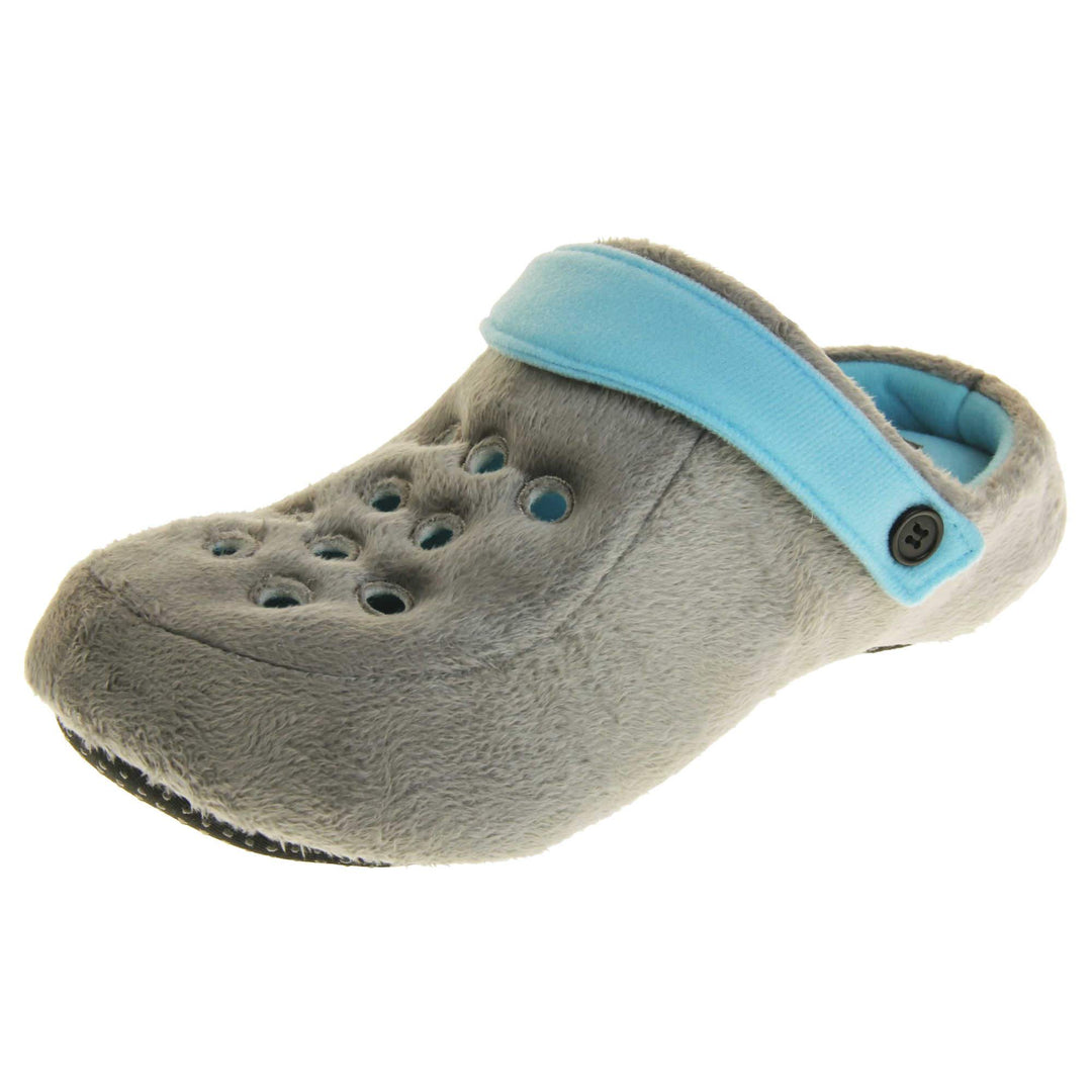 Mens clog slippers. Grey fabric clog style novelty slipper. Cut out holes on the upper. Light blue strap that goes along the back of your heel. The strap can be moved along the top of the shoe instead to make the shoe a mule. Left foot at an angle