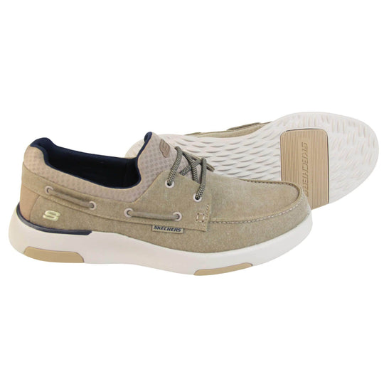 Mens deck shoes. Taupe woven textile upper with elasticated faux laces to the top and Skechers logo on the tongue and outer heel of the shoe. White synthetic sole with taupe detailing.  Both feet from a side profile with left foot behind the right on its side to show the sole