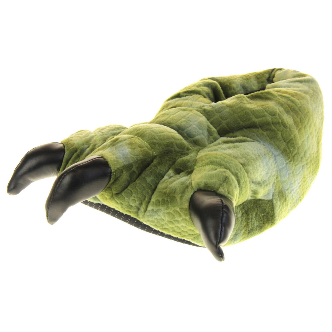 Mens dinosaur slippers. Cushioned slippers shaped like a dinosaur foot. Green textile outer with scale type pattern and black shiny padded claws. Inside is a textile lining. Black soft sole with bumps on for grip. Left foot at an angle.