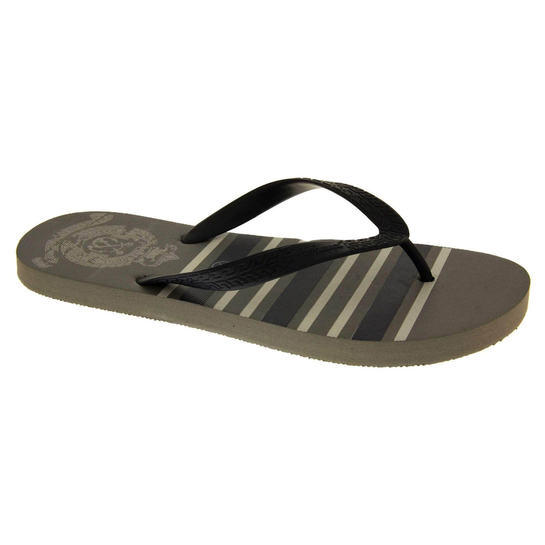 Mens flip flop sandals. Flip flop with dark grey striped sole and black strap in a toe-post design. Right foot at a slight angle.