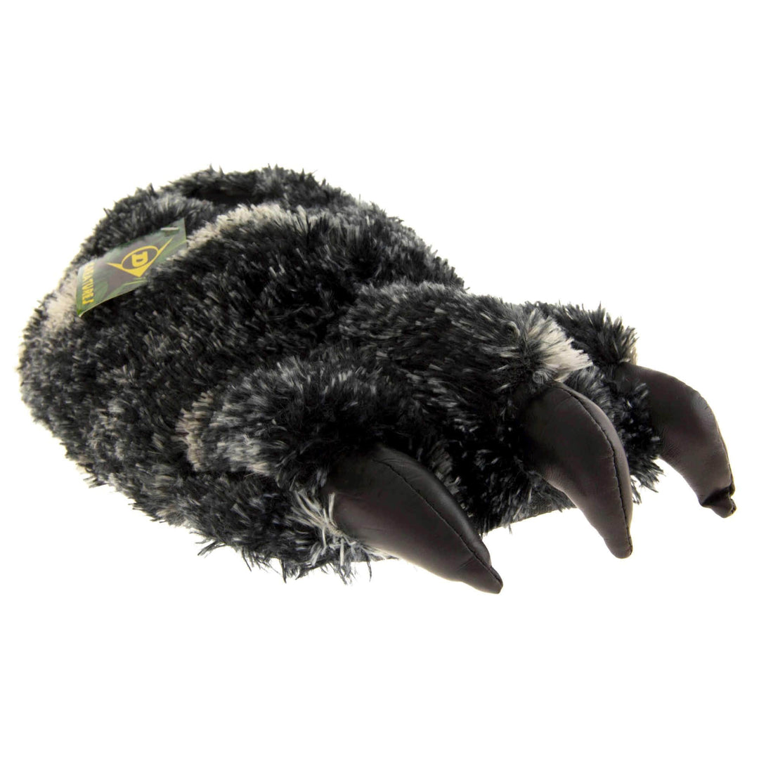 Mens fluffy slippers. Cushioned slippers shaped like a monster's foot with claws . Black and grey faux fur outer and black shiny padded claws. Inside is a textile lining. Black soft sole with bumps on for grip. Right foot at an angle.