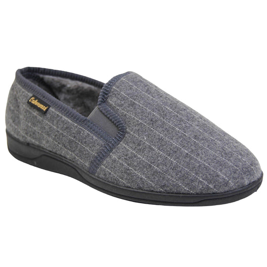Mens full back slippers. Grey wool effect upper with white pin stripes. Grey elasticated panels joining the tongue to the top of the slippers. Small black label on the outside rim, with Oakenwood branding sewn in gold. Grey faux fur lining. Right foot at an angle.
