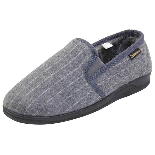 Mens full back slippers. Grey wool effect upper with white pin stripes. Grey elasticated panels joining the tongue to the top of the slippers. Small black label on the outside rim, with Oakenwood branding sewn in gold. Grey faux fur lining. Left foot at an angle.