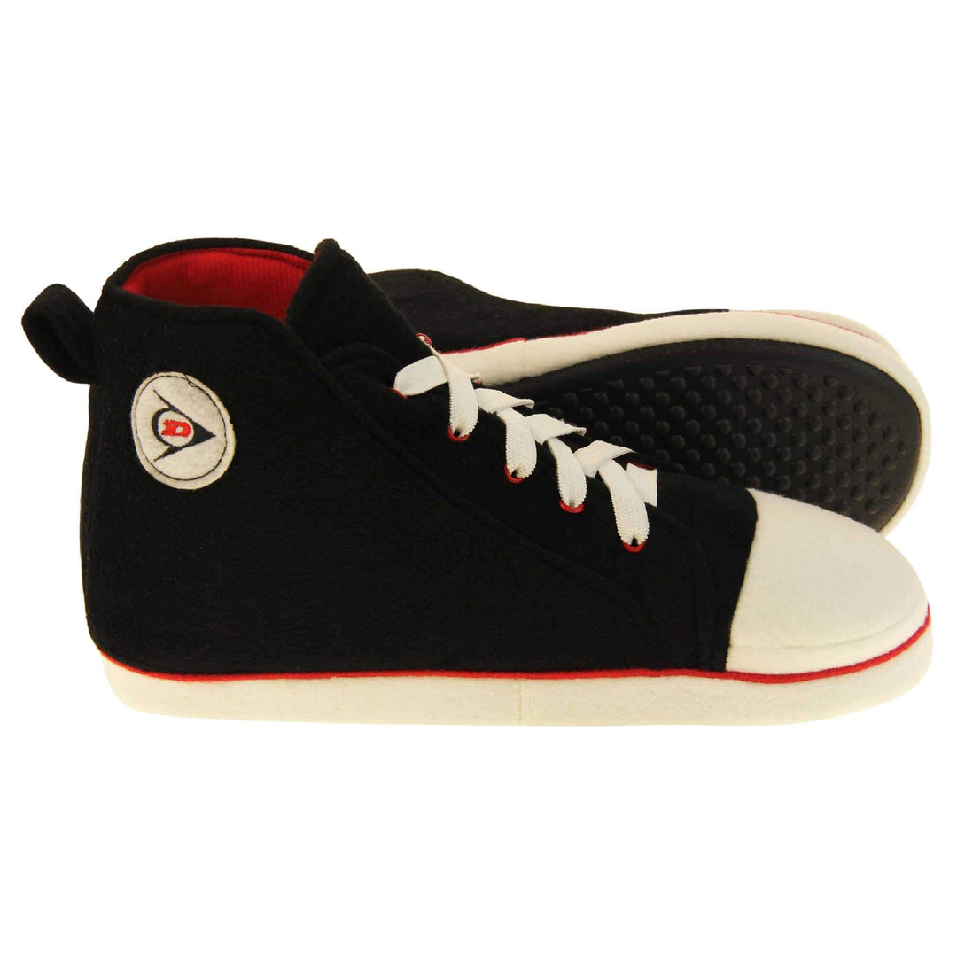Mens high top slippers. Black soft fabric upper in high-top sneaker style. With white elasticated laces and white circle with Dunlop logo to the side. White edge around the sole of the shoe. Red textile lining. Black sole with bumps for grips. Both feet from side profile with left foot on its side to show the sole.