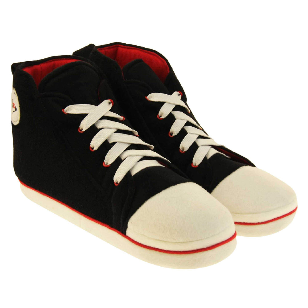 Mens high top slippers. Black soft fabric upper in high-top sneaker style. With white elasticated laces and white circle with Dunlop logo to the side. White edge around the sole of the shoe. Red textile lining. Black sole with bumps for grips.  Both feet together at an angle.