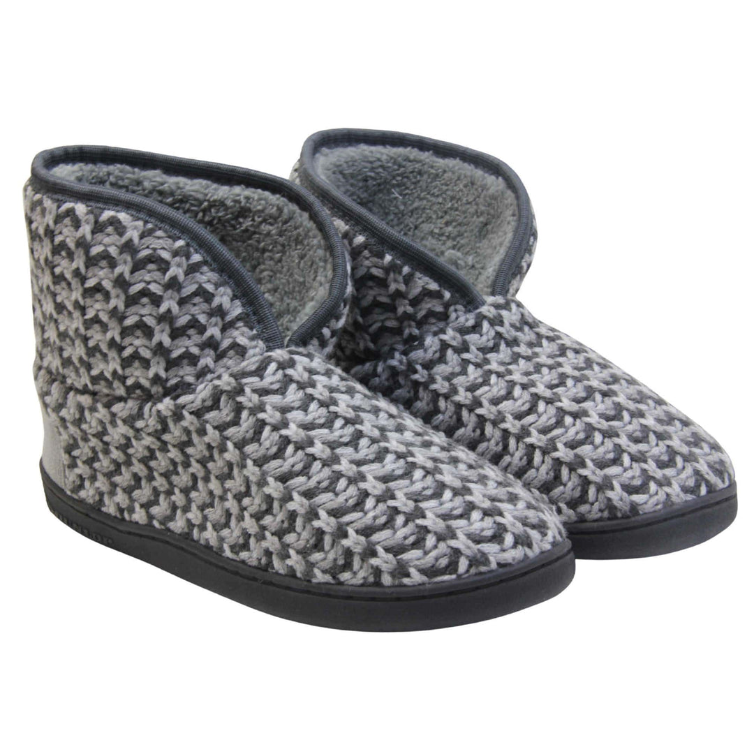 Mens knit slipper boots. Slipper boots with a grey knit upper. Dark grey fabric piping around the collar. Grey textile patch over the heel to reinforce. Thick black synthetic sole with Dunlop branding on. Grey faux fur lining. Both feet together at a slight angle.