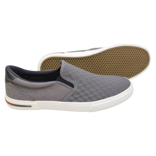 Mens lightweight trainers. Grey loafer style trainers with the upper made up of woven mesh for the front half and denim effect textile for the back. With a black faux-leather half circle to the heel with Oakenwood logo on. Black elasticated side gussets and black textile lining. Thick white sole. Both feet from a side profile with the left foot on its side behind the the right foot to show the sole.