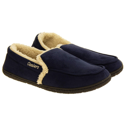 Mens lined slippers. Full back slippers with navy blue faux suede upper with cream synthetic fur detail. Cream Coolers branding on the outside. Cream faux fur lining. Black sole with grip.  Both feet together at an angle.