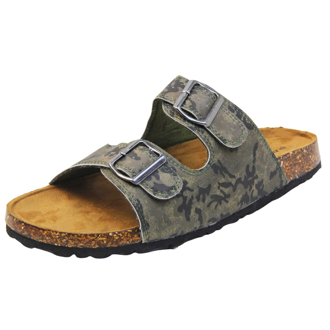 Mens memory foam sandals. Double strap camouflage print faux leather upper with silver buckles. Brown faux suede insole with Dunlop branding. Cork style outsole with black base. Left foot at an angle.