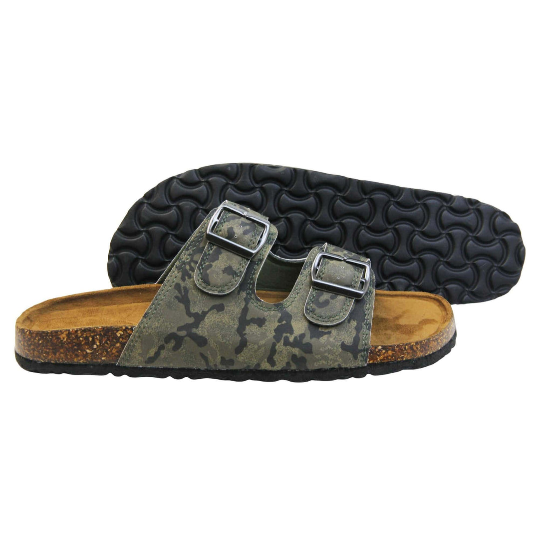 Mens memory foam sandals. Double strap camouflage print faux leather upper with silver buckles. Brown faux suede insole with Dunlop branding. Cork style outsole with black base. Both feet from a side profile with left foot behind the right on its side to show the sole.