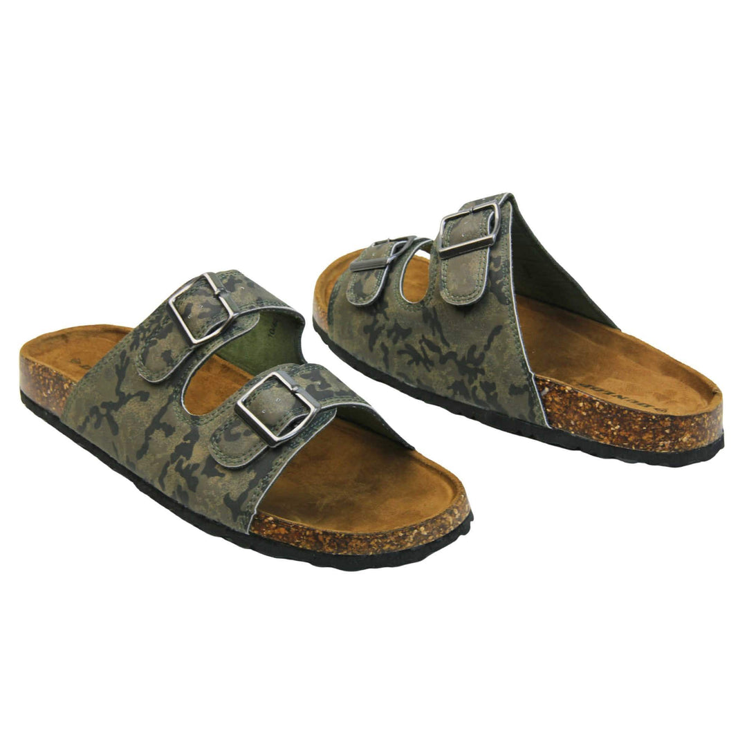 Mens memory foam sandals. Double strap camouflage print faux leather upper with silver buckles. Brown faux suede insole with Dunlop branding. Cork style outsole with black base. Both feet at an angle facing top to tail.