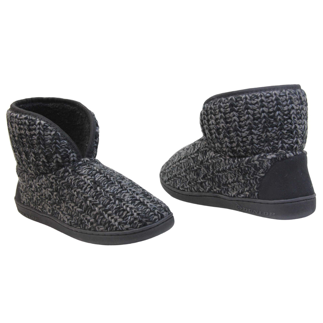 Mens memory foam slipper boots. Slipper boots with a black knit upper. Black fabric piping around the collar. Black textile patch over the heel to reinforce. Thick black synthetic sole with Dunlop branding on. Black faux fur lining. Both slippers slightly at an angle facing top to tail.