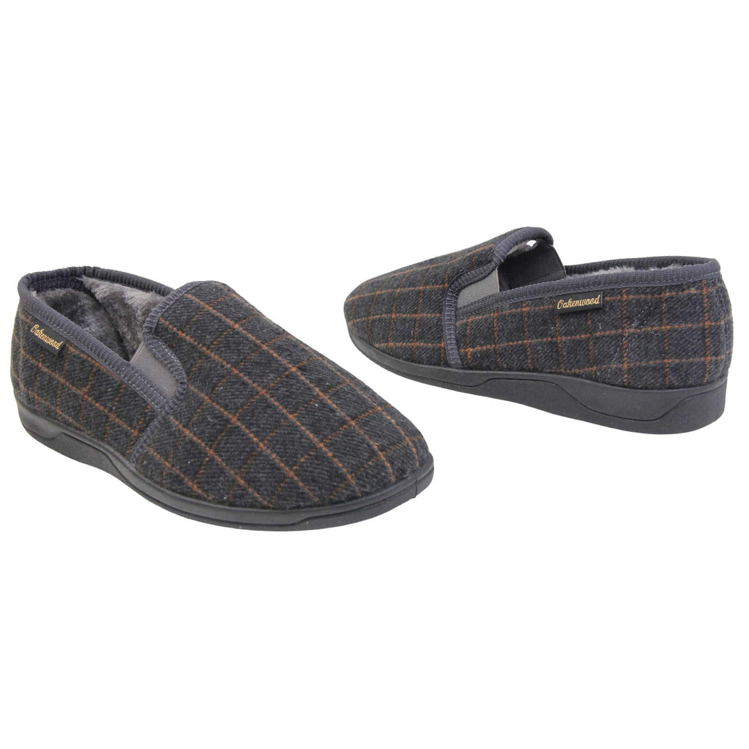 Mens memory foam slippers. Full back slippers with grey wool effect upper with orange check. Grey elasticated panels joining the tongue to the top of the slippers. Small black label on the outside rim, with Oakenwood branding sewn in gold. Grey faux fur lining. Both feet facing top to tail, at an angle.